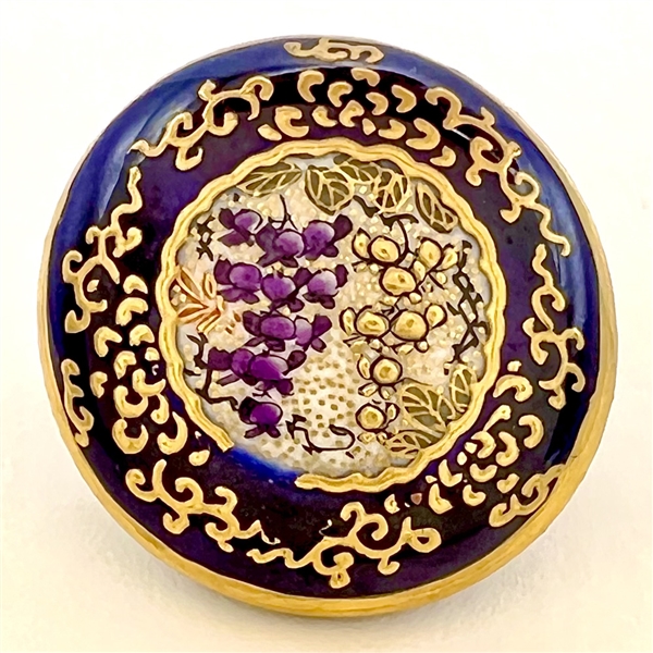 Satsuma button of Wisteria in an ornate cobalt border.