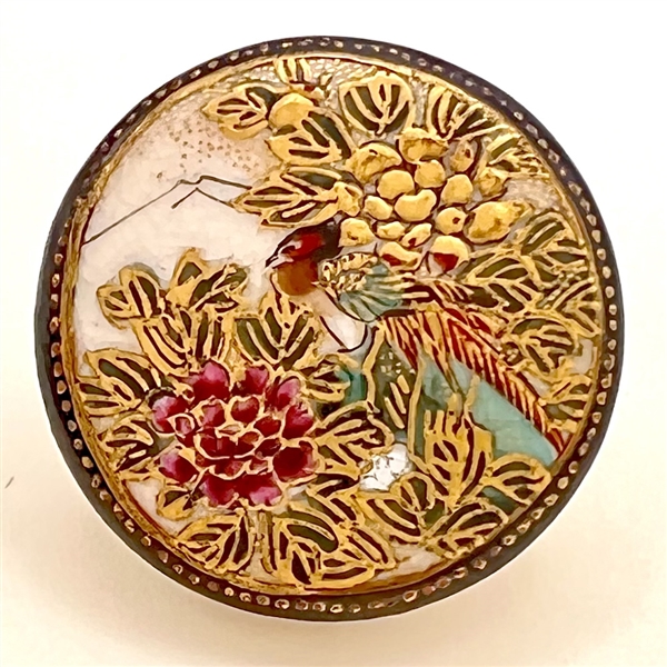 Satsuma button of a pheasant among Chrysanthemums.