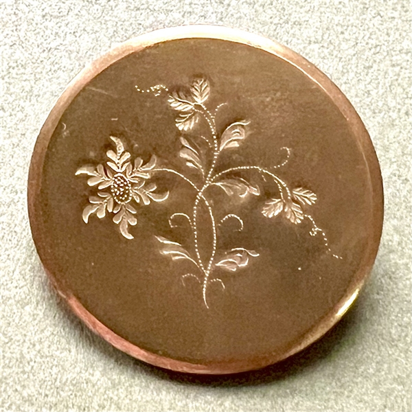 An 18th c. Chased copper Colonial button of a flower.