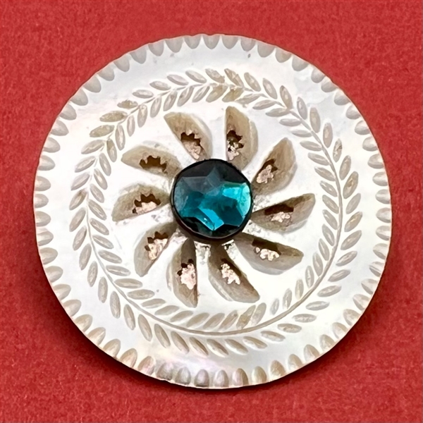 An 18th c. carved mother of pearl  button with aqua paste pin shank.