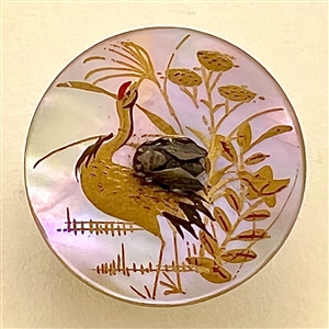 Shell button of a water bird with metal fly.