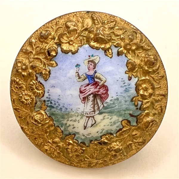 A 19th c. painted enamel button “Lady holding a sprig of flowers”