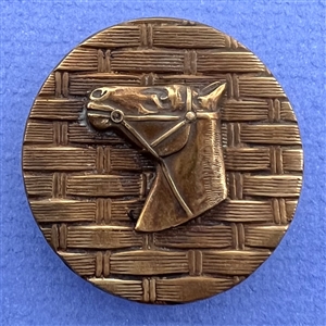 Horse head over woven background button.