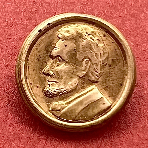 “Abraham Lincoln” commemorative button.