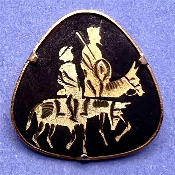 Damascene button of figures on horseback.