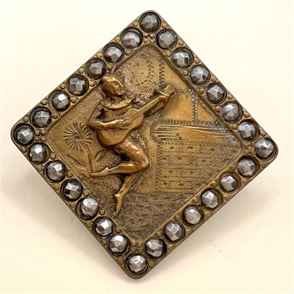 Brass button of “Mephisto Serenading.”