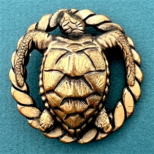 Brass sea turtle button by Sam Biern.