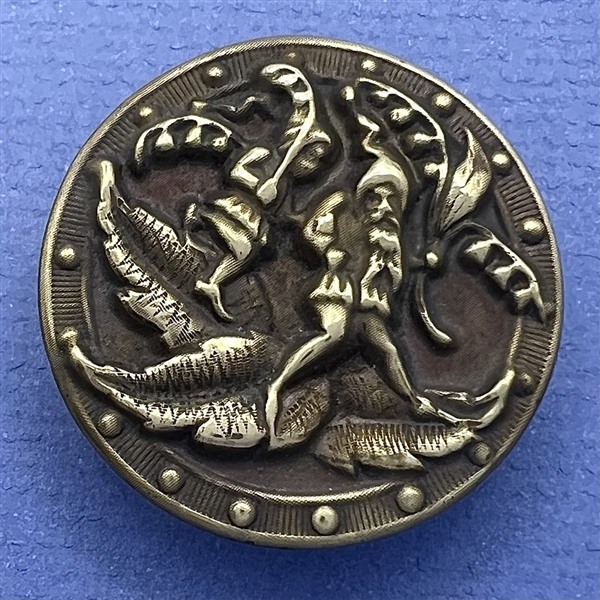 Large “Gnomes Carrying Lilies of the Valley” brass button.