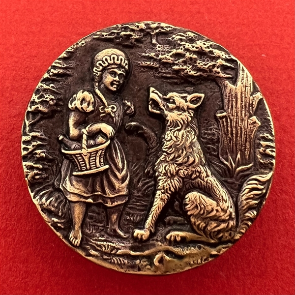 Scarce large “Red Riding Hood and the Wolf” brass button.