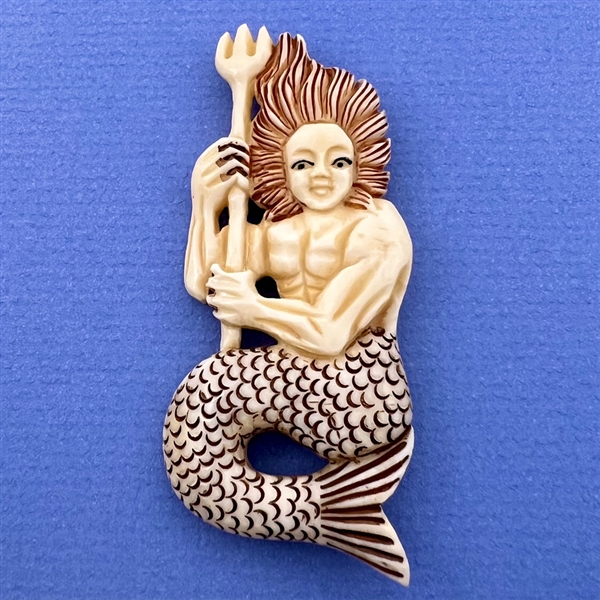 HUGE natural material button of a merman.