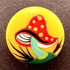 Brooks painted casein button of a mushroom.