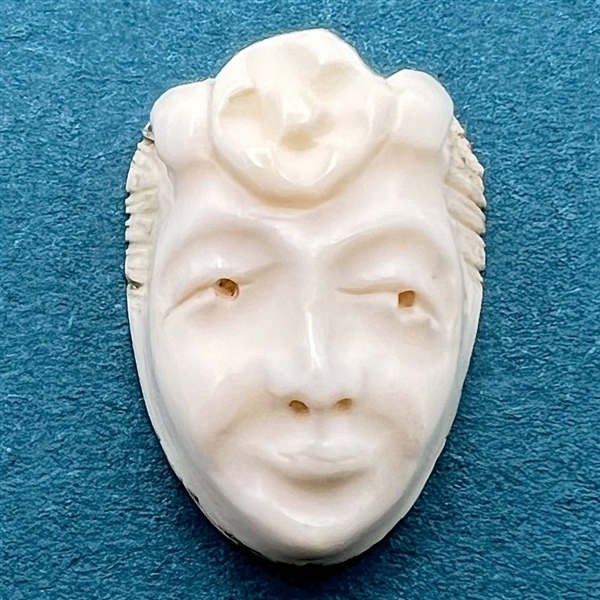 HIGHLY COLLECTIBLE Motiwala button of a woman’s head.