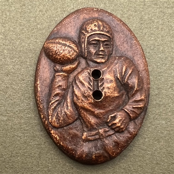 Burwood button of a football player.