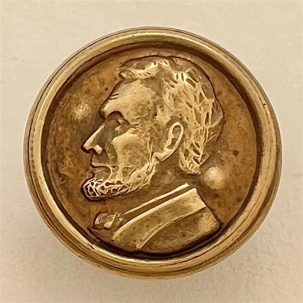 “Abraham Lincoln” commemorative button.