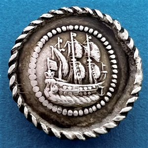 Continental silver button of a sailing ship.