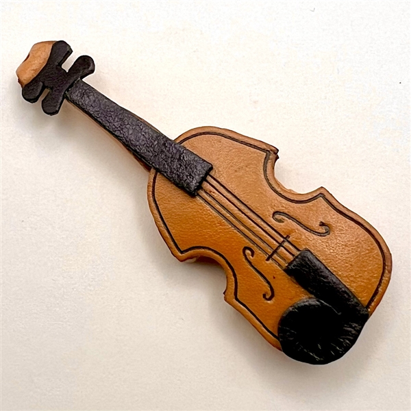 Large realistic violin leather button.