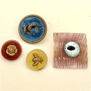 Four cold enamel studio buttons by Kevin Kinne.