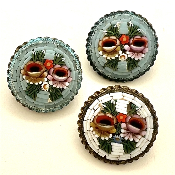 Three Italian mosaic buttons of flowers.