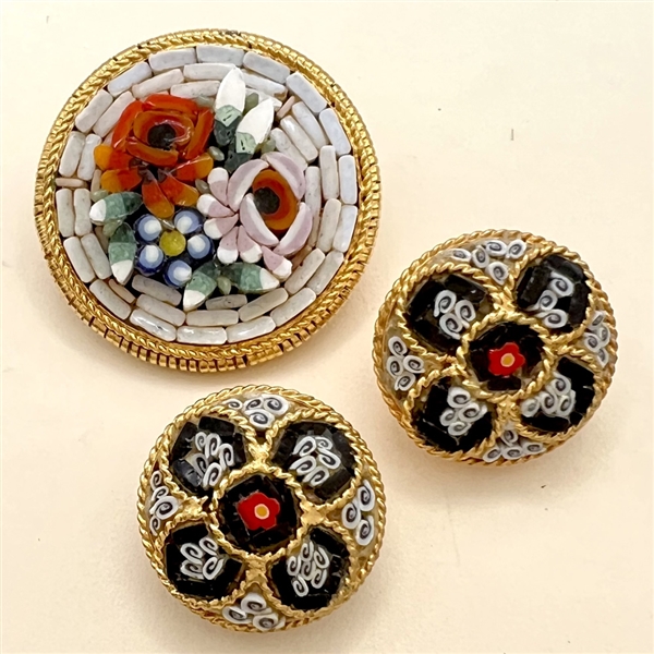 Three Italian mosaic buttons of flowers and patterns.