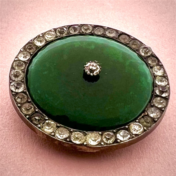 A 19th c. Green glass in silver button with pastes.