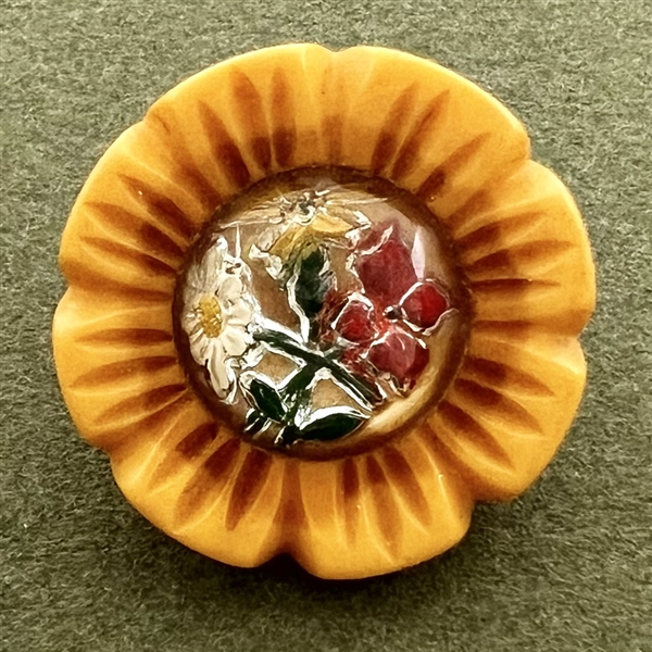 Design under glass Bakelite button.