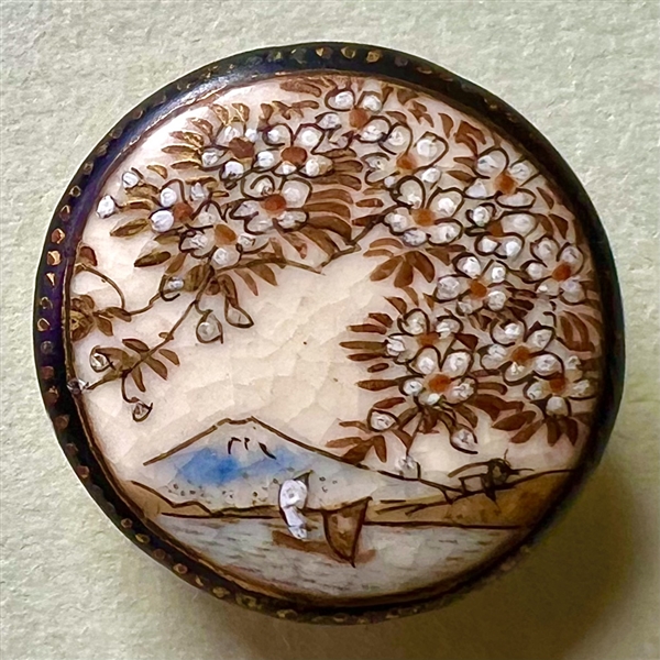 Satsuma button of Mt. Fuji with lake, boats and cherry blossoms.