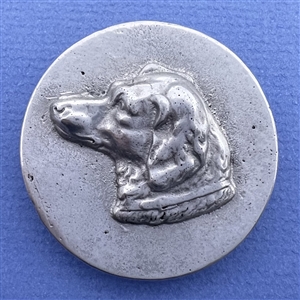 Large aluminum button of a dog head by Eutzy.