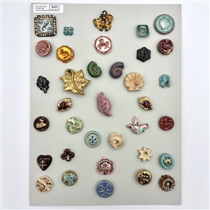 Card of thirty five ceramic buttons.