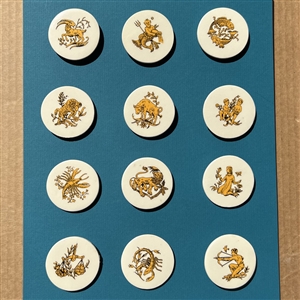 Set of twelve porcelain zodiac buttons.