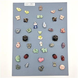 Card of thirty seven ceramic buttons.