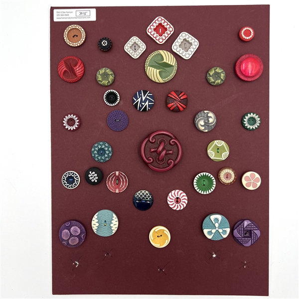 Card of thirty four buffed celluloid buttons.