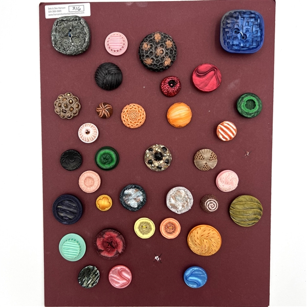 Card of thirty four French textured plastic buttons.