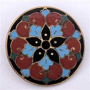 A champlevé enamel button.