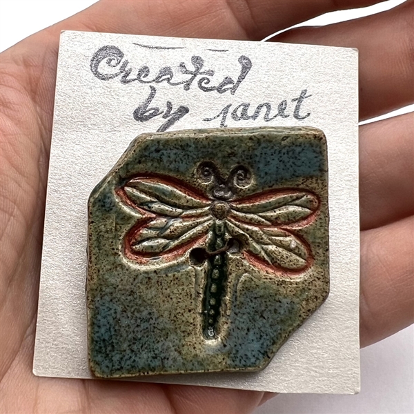 Ceramic studio button of a dragonfly by “Janet.”