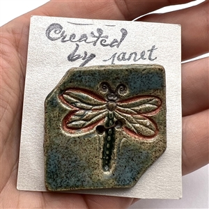 Ceramic studio button of a dragonfly by “Janet.”