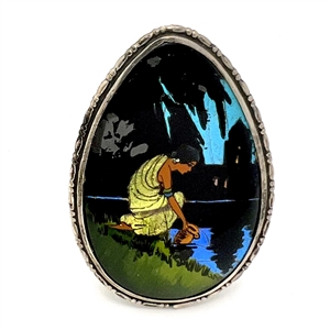 Reverse painted teardrop shaped button of woman gathering water.