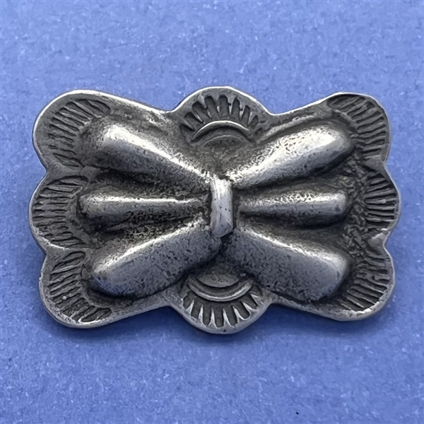 Pewter button with Native American butterfly design.