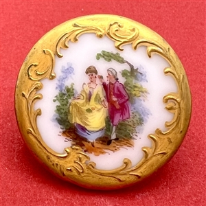 Lovely porcelain button of courting couple with rococo border.