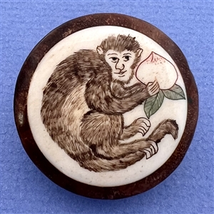 Monkey with turnip wood button.