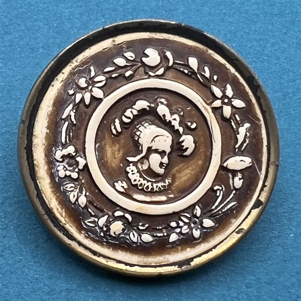 Ivoroid button of a man with floral inner border.