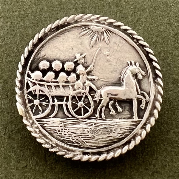 Hallmarked silver button of a horse drawn cart.