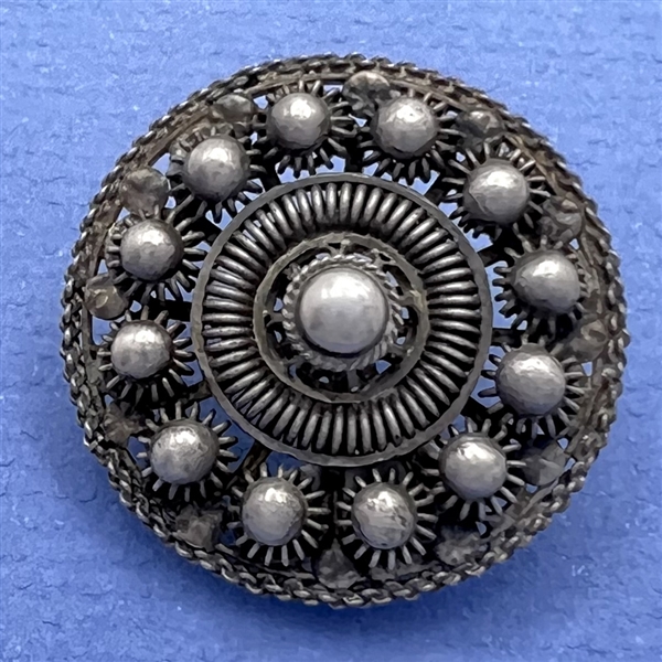 Peasant silver filigree dress button.