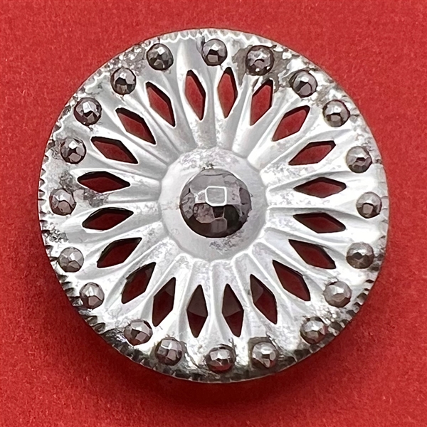 An 18th c. Pierced steel button.