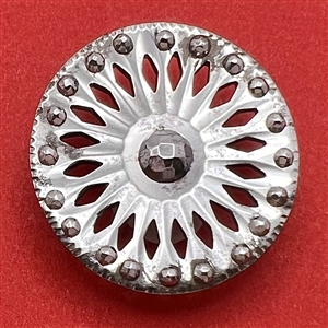 An 18th c. Pierced steel button.