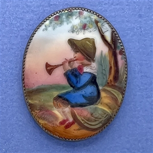 Ceramic oval button of a little boy blue.