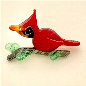 Mary Gaumond’s red bird glass studio button.