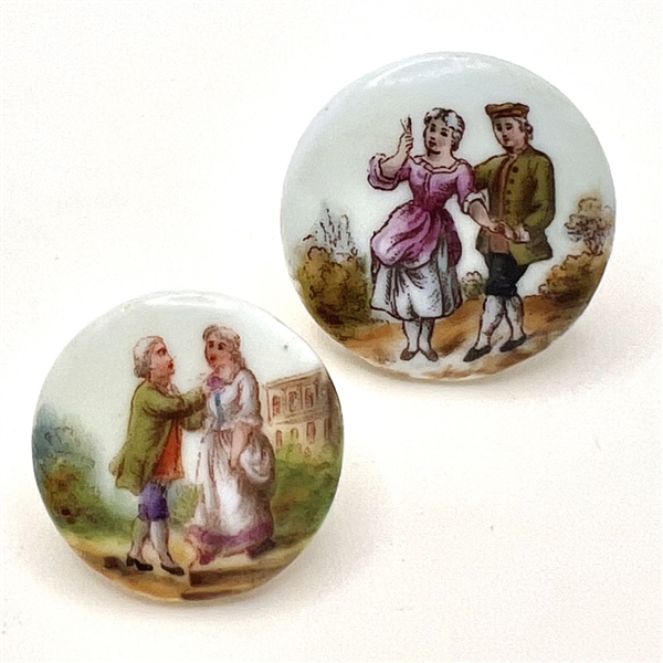 Two ceramic buttons of courting couples.