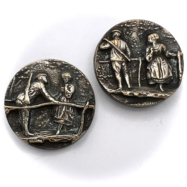 Two brass buttons of peasant and girl on footbridge. 