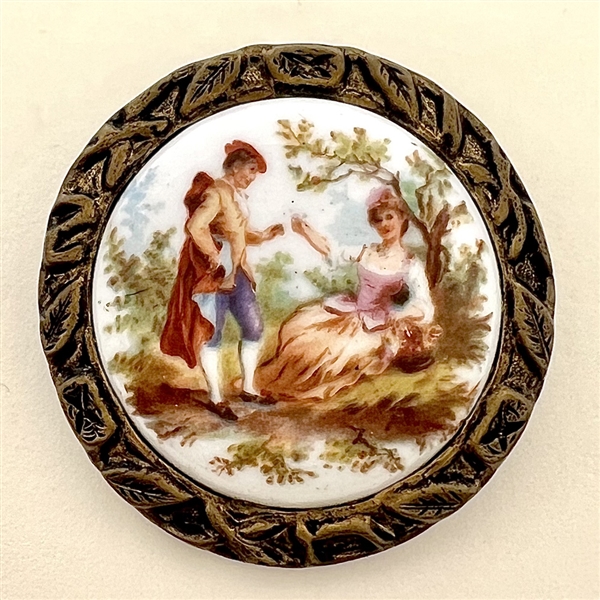 Ceramic button of courting couple.