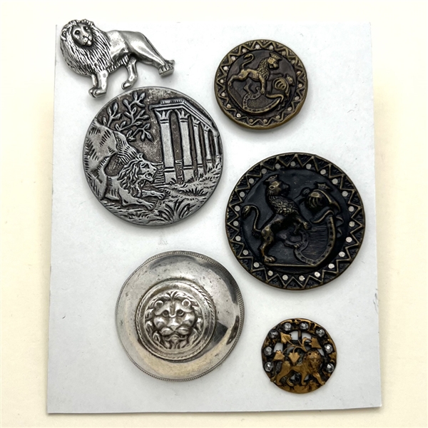 Six assorted metal buttons of lions.